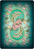 Decorative card with floral design and circular emblem on a teal background
