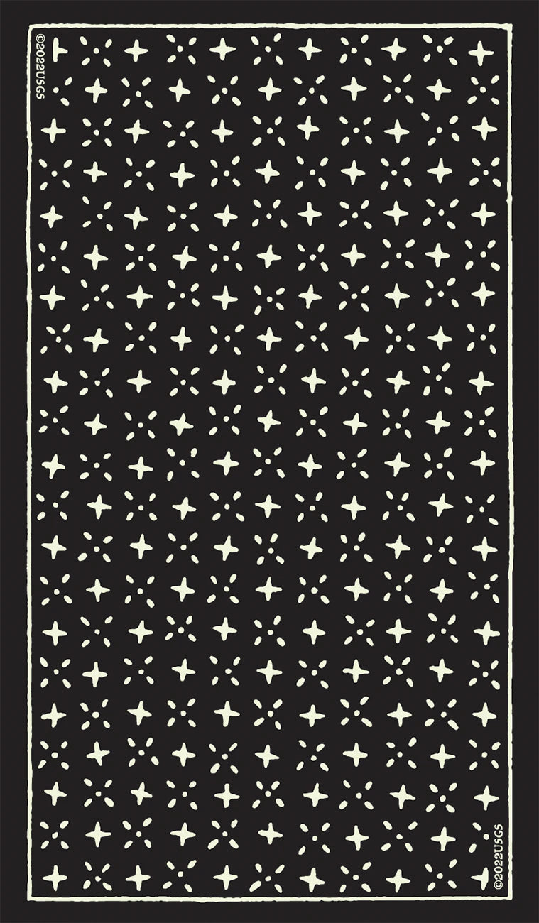 Black and white patterned rug with star-like shapes