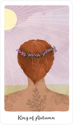 Card with a stylized illustration of a person with tattoos and a flower crown, titled 'King of Autumn'.