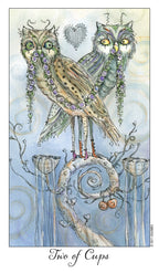 Two decorative owls with floral elements on a branch with the text 'Two of Cups'.
