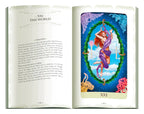 Open book with a tarot card illustration titled 'The World' on a white background