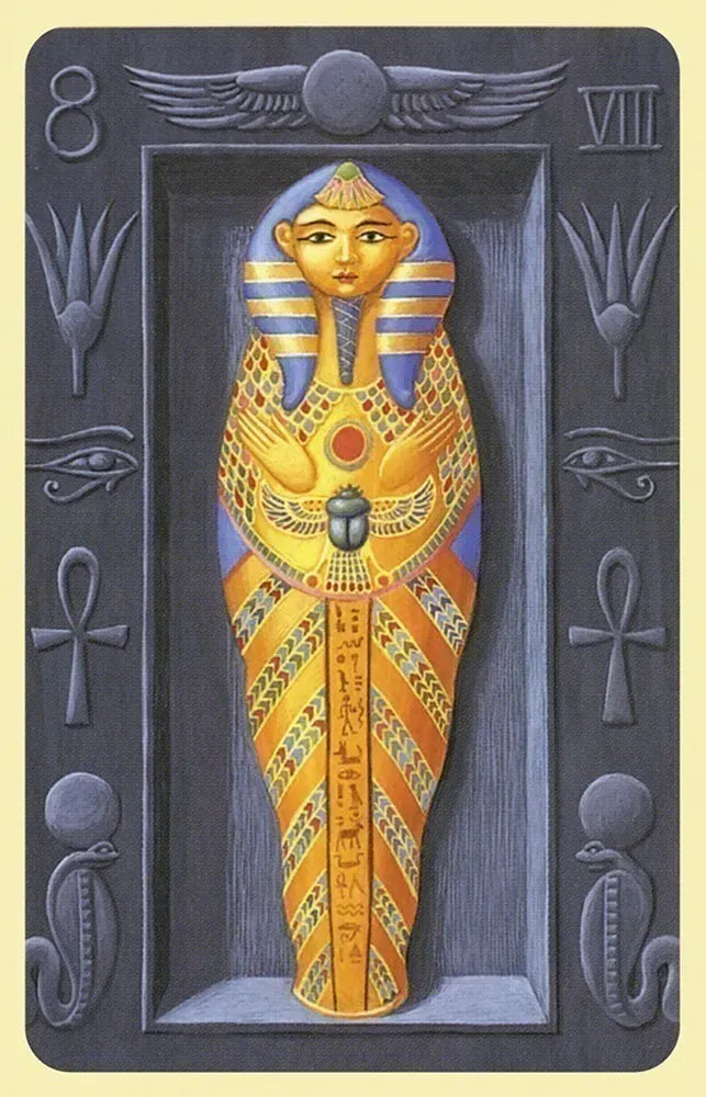 Card with an Egyptian-themed design featuring a mummy and hieroglyphics on a dark background.