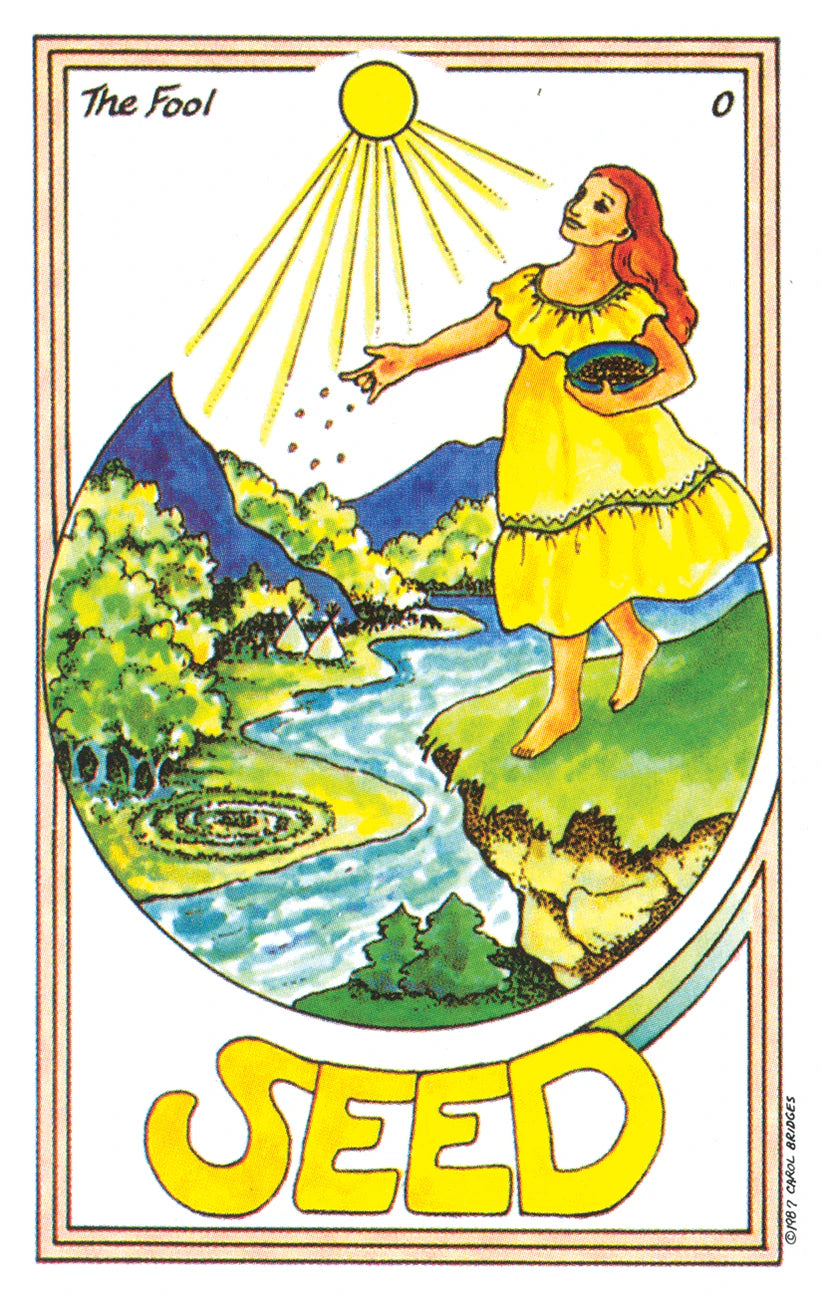 Tarot card titled 'Seed' featuring a woman in a yellow dress planting seeds with mountains and a river in the background.