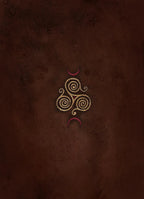 A textured dark brown leather-like surface featuring a central gold Celtic triskelion symbol flanked by two small red crescent moons.