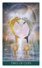 Two dolphins facing each other over two cups with a celestial background, labeled 'Two of Cups'.