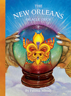 Cover of 'The New Orleans Oracle Deck' with a colorful crystal ball and hands holding it.