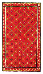 Red patterned rug with a geometric design on a white background