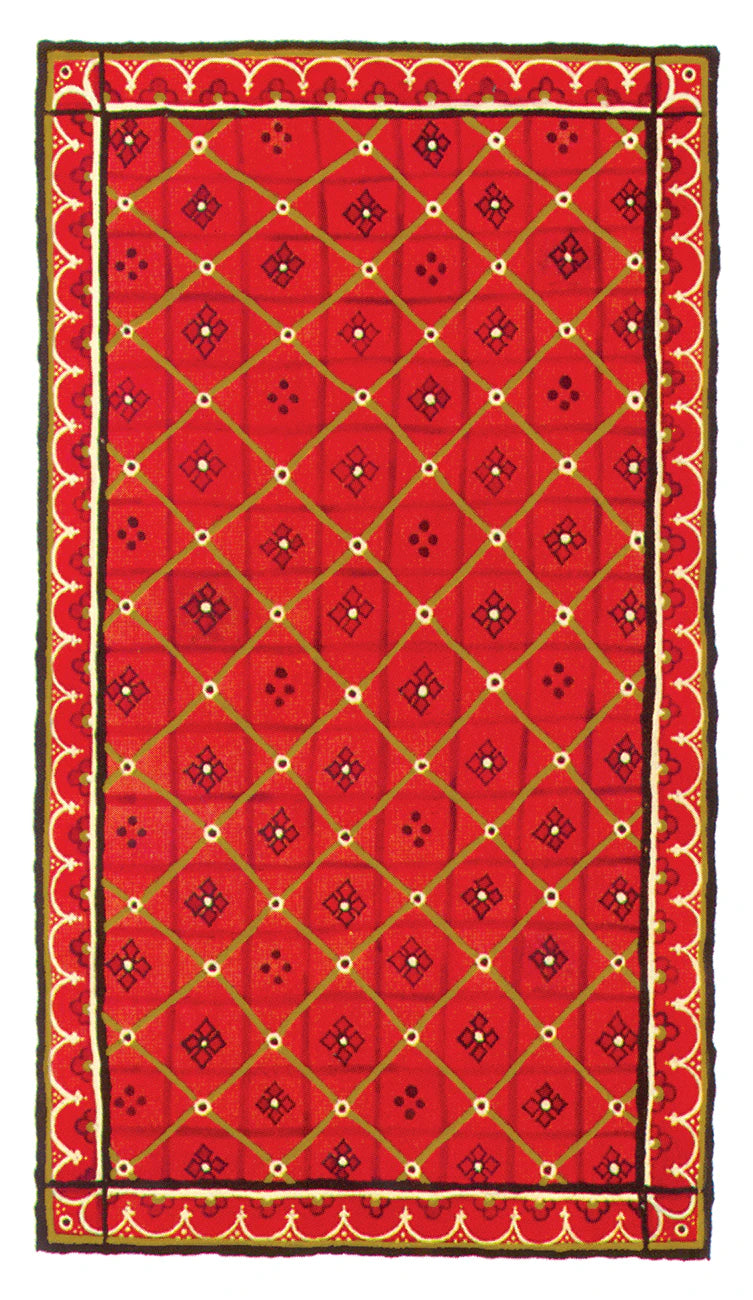 Red patterned rug with a geometric design on a white background