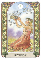 Tarot card featuring a woman holding a box of butterflies with decorative border and 'Butterfly' text at the bottom.