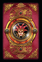 Decorative mask with gold frame on a red background