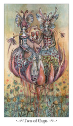 Two fairy-like figures with butterfly wings holding cups, standing on a flower with 'Two of Cups' text at the bottom.