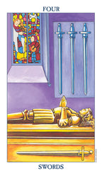 Tarot card with a figure lying down, two swords, and a stained glass window.