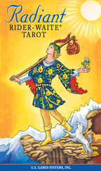 Cover of 'Radiant Rider-Waite Tarot' with a person in colorful clothing and a goat on a mountainous background.