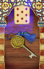 Decorative card with a key, tassel, and geometric design on a wooden background
