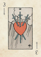 Card with three swords piercing a heart on a textured beige background