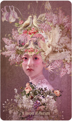 Artistic card featuring a woman's face surrounded by flowers, birds, and text on a pink background.
