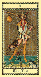 Tarot card featuring 'The Fool' with a person holding a lantern and a dog, on a decorative border.