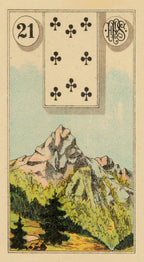 Playing card with clubs symbol and mountain landscape
