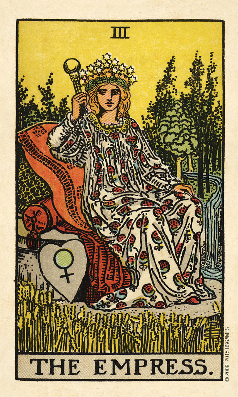 Tarot card featuring 'The Empress' with a woman in a floral dress sitting on a rock.