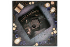 Product packaging for 'Tabula Mortem' with decorative elements on a dark background