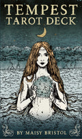 Book cover of 'Tempest Tarot Deck' featuring a woman holding a moon in a stormy landscape.