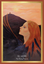 Artistic depiction of a woman with red hair looking upwards, with '32. Hope' and 'The Rising Phoenix' text at the bottom.