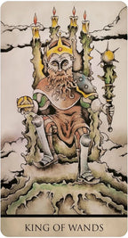 King of Wands tarot card with a figure on a throne, candles, and a sword.