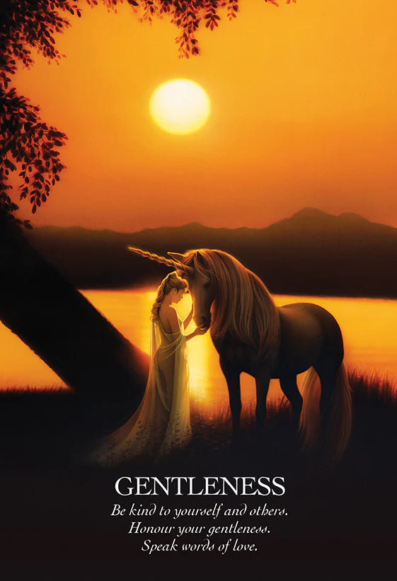 Woman and unicorn standing by a lake at sunset with a motivational quote.
