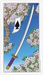 Card with a sword and black spade symbol surrounded by cherry blossoms on a blue background