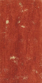 Textured red surface with a rough finish