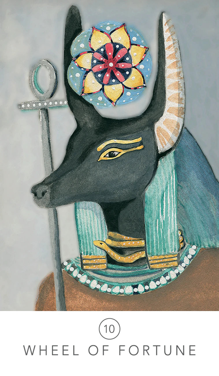 Decorative item with a stylized animal figure, colorful flower design, and hieroglyphic symbol on a gray background.