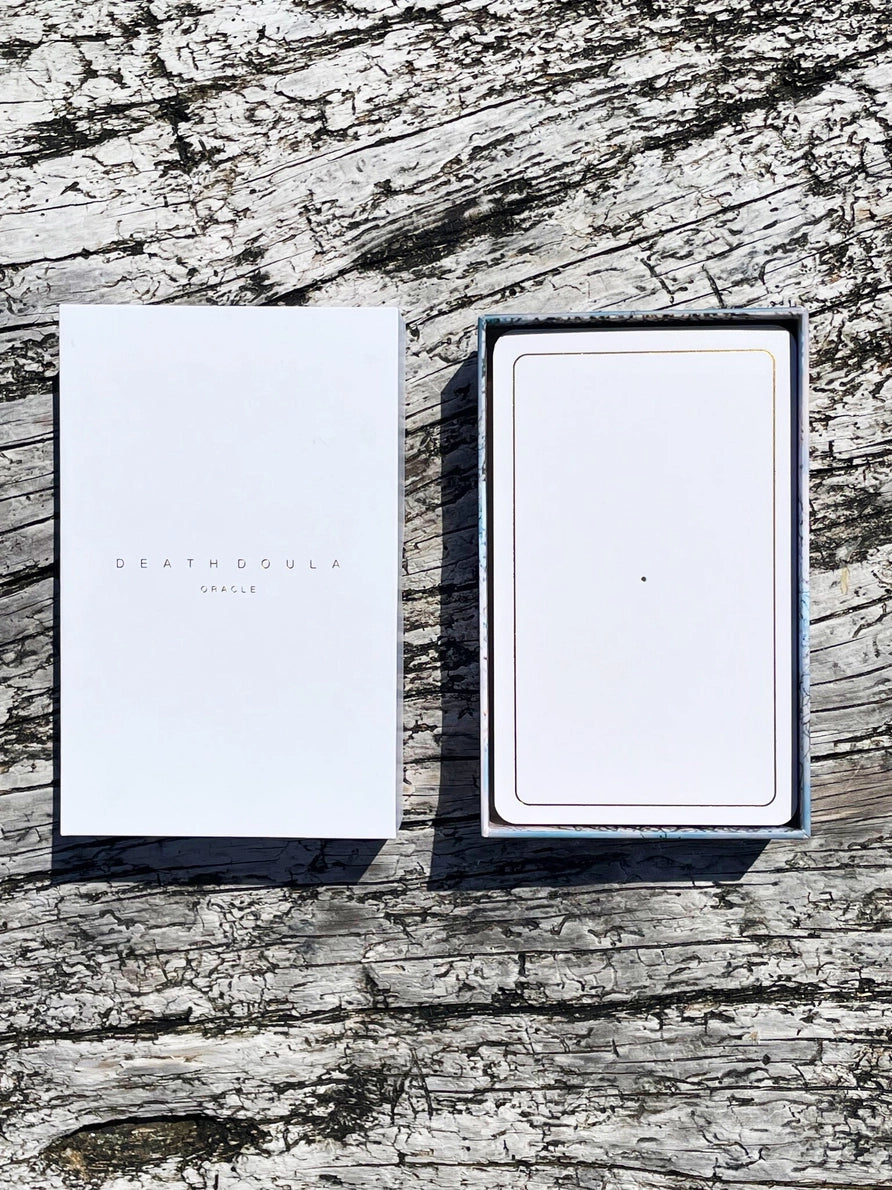 Two white boxes with 'DEATH BY AIR' branding on a textured wooden surface