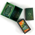 Green tarot card box with tarot cards on a white background