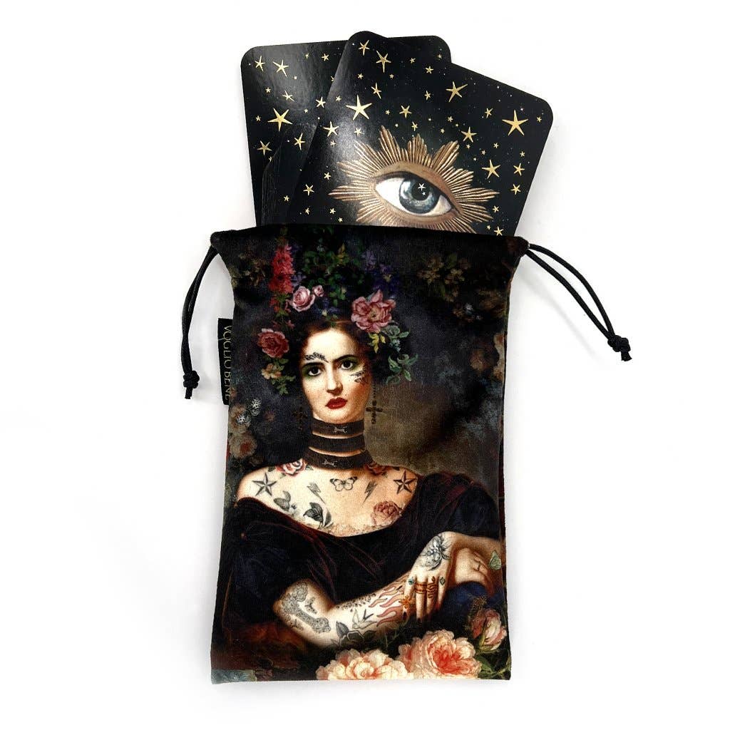 Drawstring pouch with a tattooed woman design and cards featuring an eye and star design on a white background.