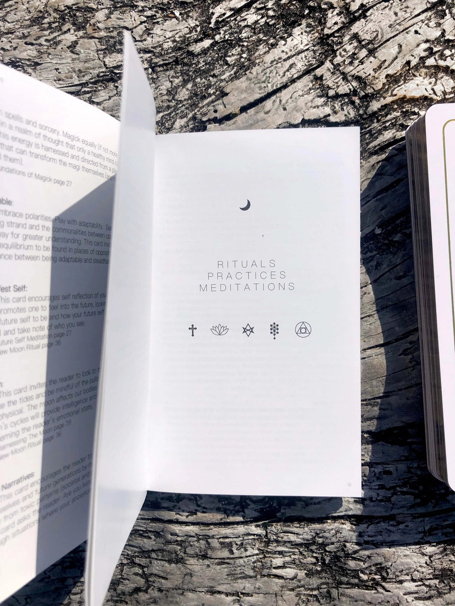 White book with 'Rituals, Practices, Meditations' on a textured surface