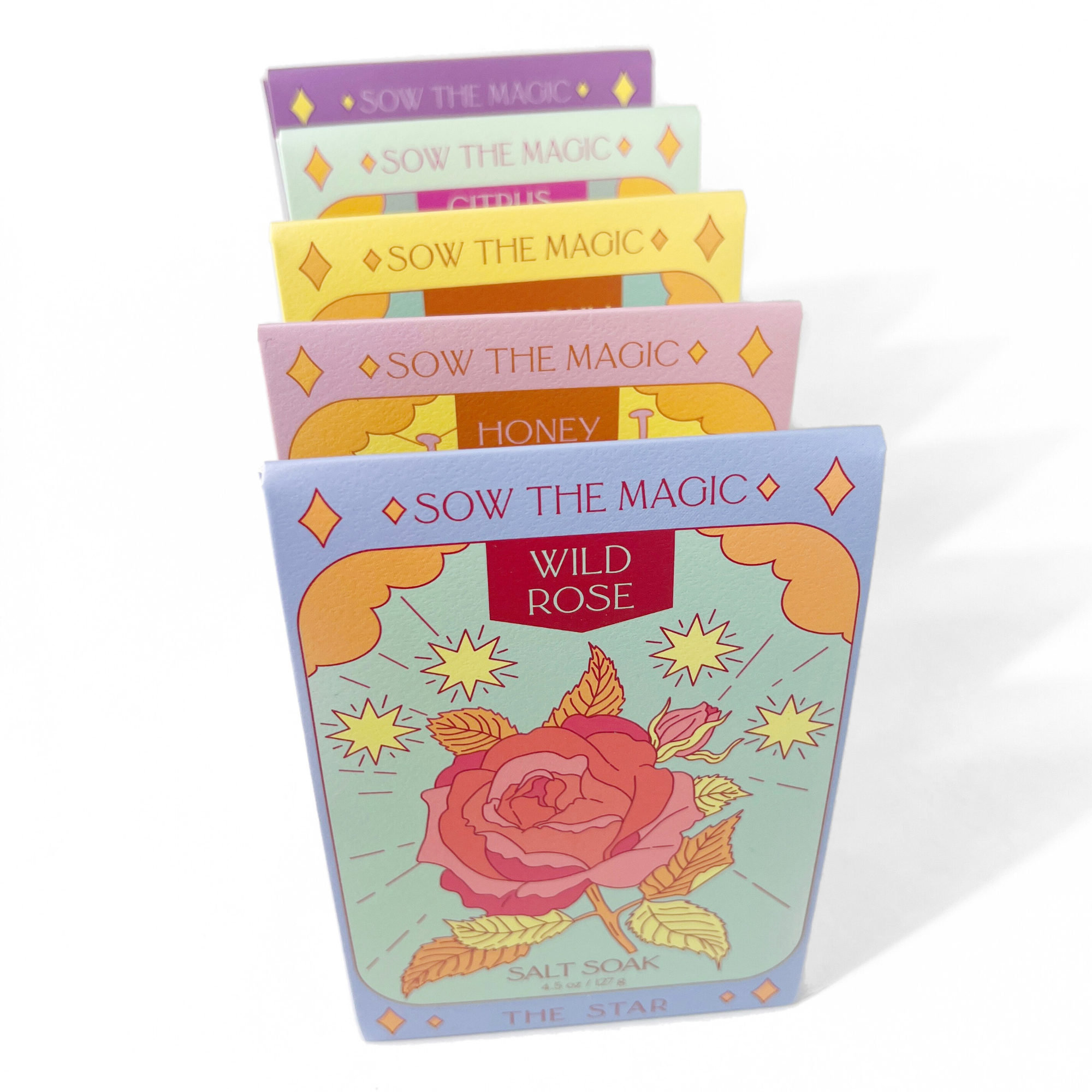 Set of 'Sow the Magic' product packages with floral designs on a white background