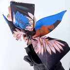 Floral patterned headscarf with blue and pink colors on a white background