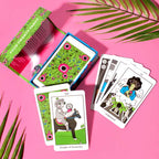 Playing cards with unique designs on a pink background