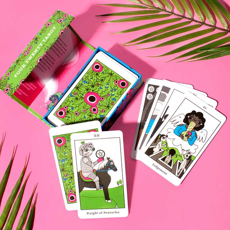 Playing cards with unique designs on a pink background