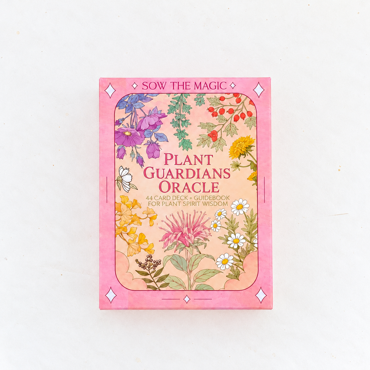 Plant Guardians Oracle card deck box by Sow the Magic, featuring a pink border and a central illustration of various colorful wildflowers and botanicals on a white background.