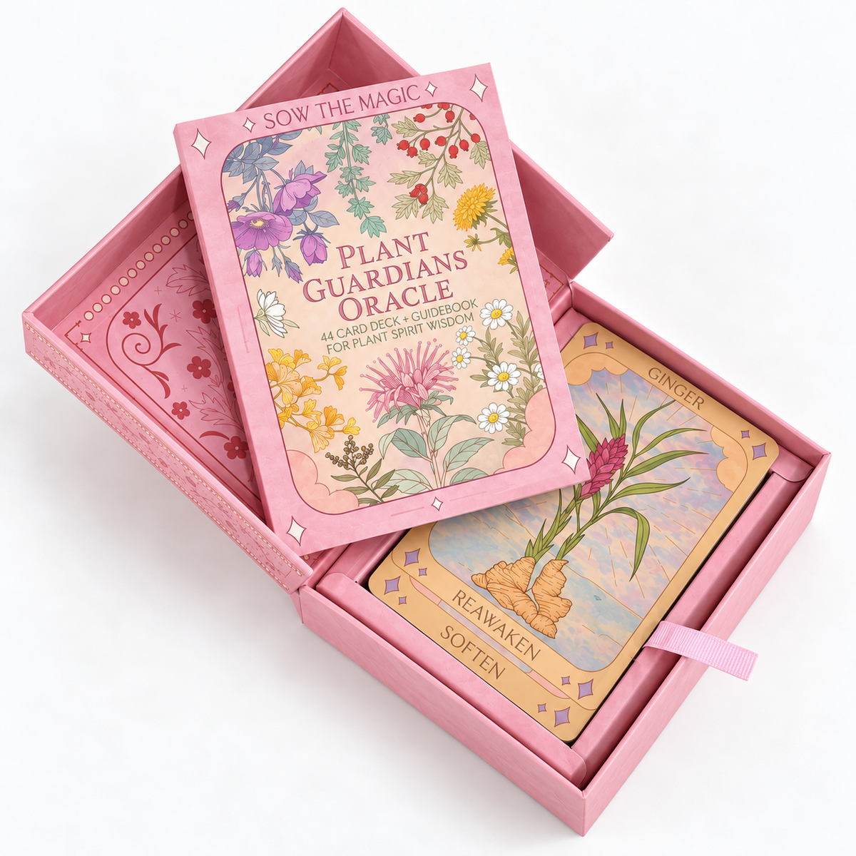 The Plant Guardians Oracle card deck in its pink box, shown open with the lid leaning on top and one card titled 'Ginger' visible inside. The box lid features colorful botanical illustrations and the text 'SOW THE MAGIC' and 'PLANT GUARDIANS ORACLE'.