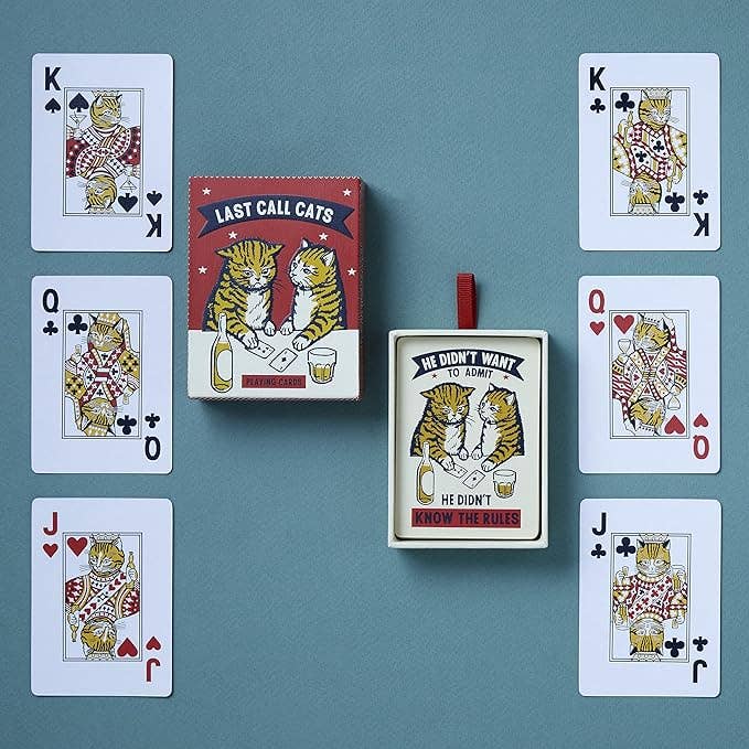 Playing cards with cat-themed artwork on a blue background