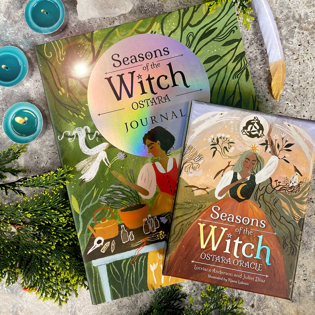 Two books titled 'Seasons of the Witch' on a textured surface with candles and greenery.