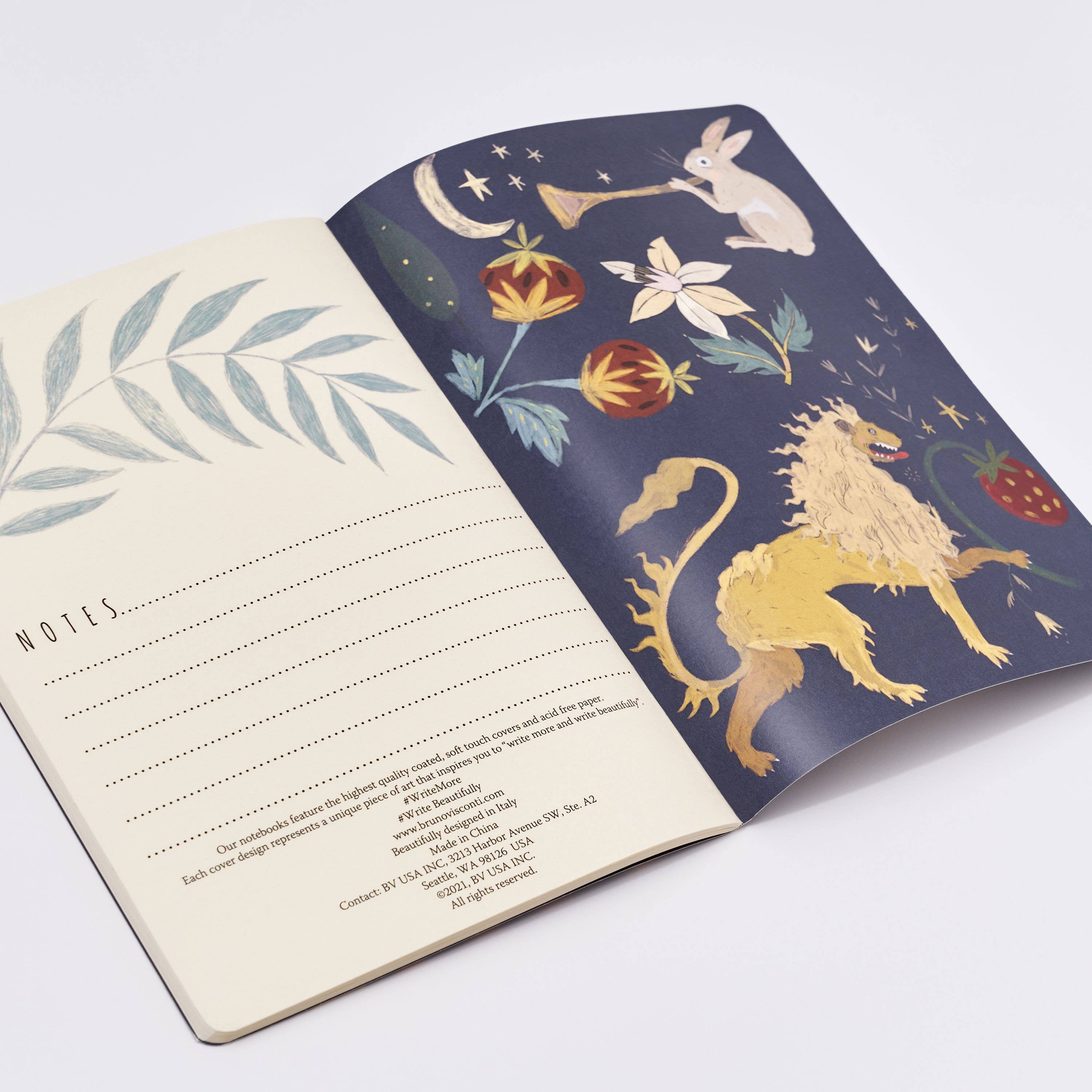 Open notebook with one page featuring a lion illustration and the other with floral design on a white background.