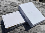 Two white boxes with 'DEAN & DEAN' branding on a wooden surface