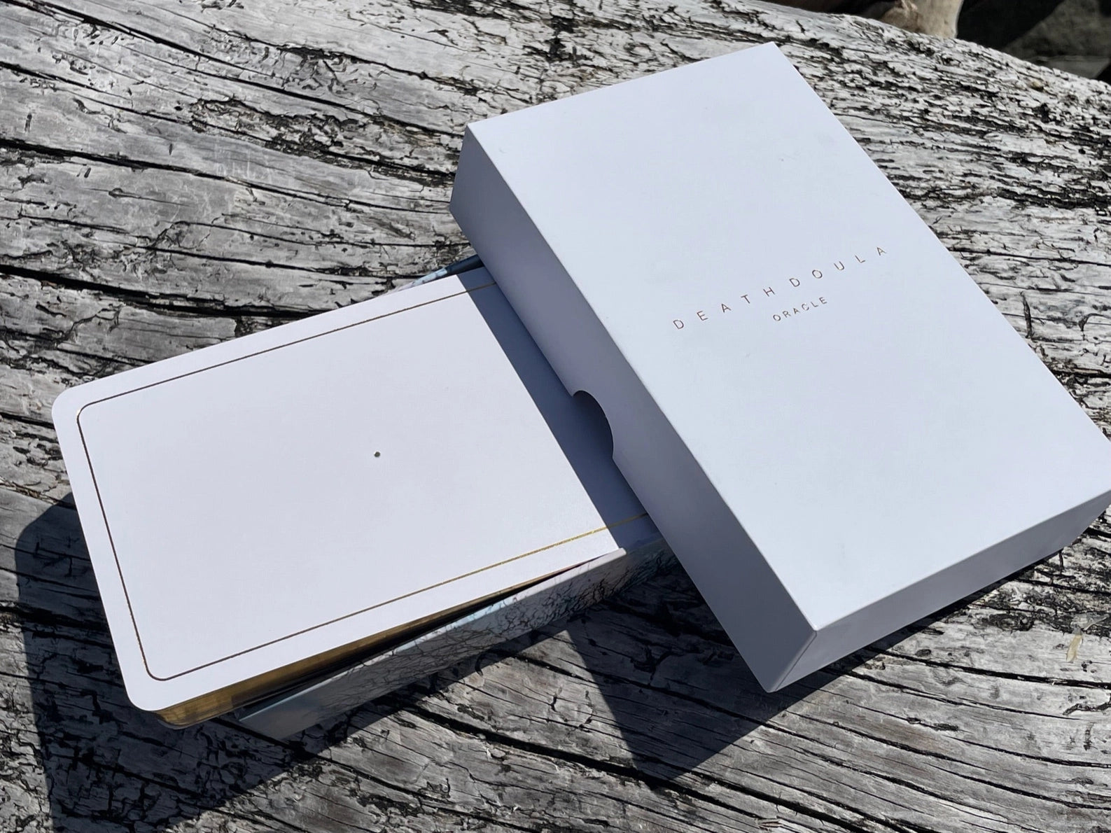 Two white boxes with 'DEAN & DEAN' branding on a wooden surface