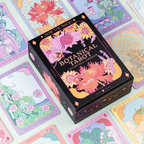 Botanical Tarot card set with colorful tarot cards displayed around the box.