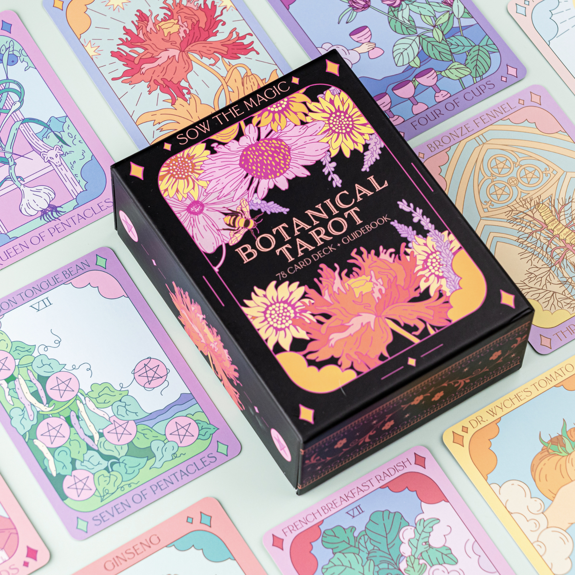 Botanical Tarot card set with colorful tarot cards displayed around the box.