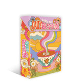Colorful card deck packaging with floral and abstract designs on a white background