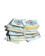 Set of colorful notebooks with decorative patterns on a white background